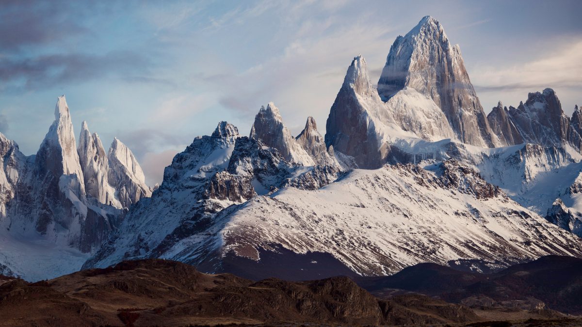 Snow-covered granite spires of Fitz Roy rising above the Patagonian mountains