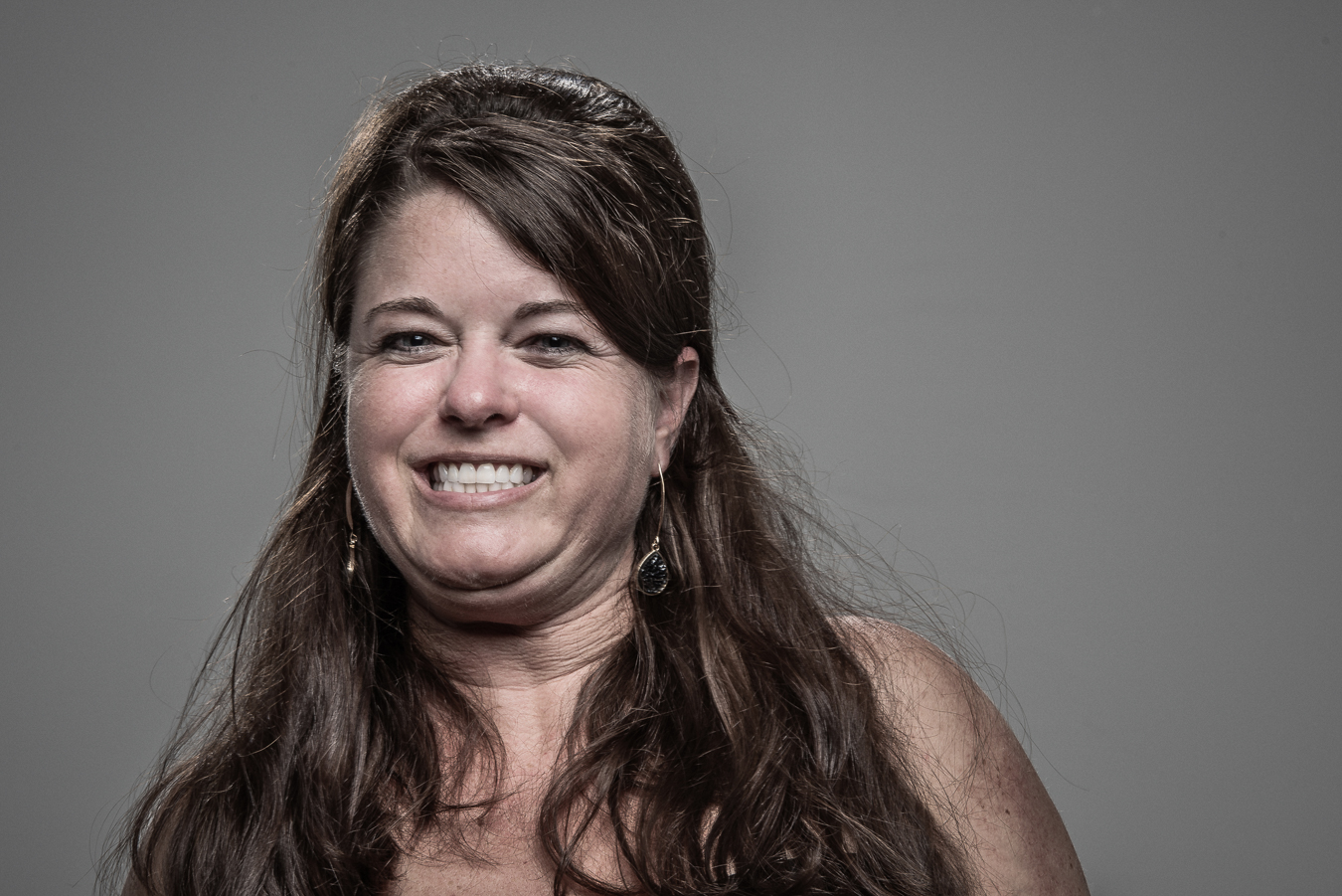 Studio headshot portrait 40 from the Stun Gun Photoshoot series, person crying out mid-shock as they are hit with a stun gun