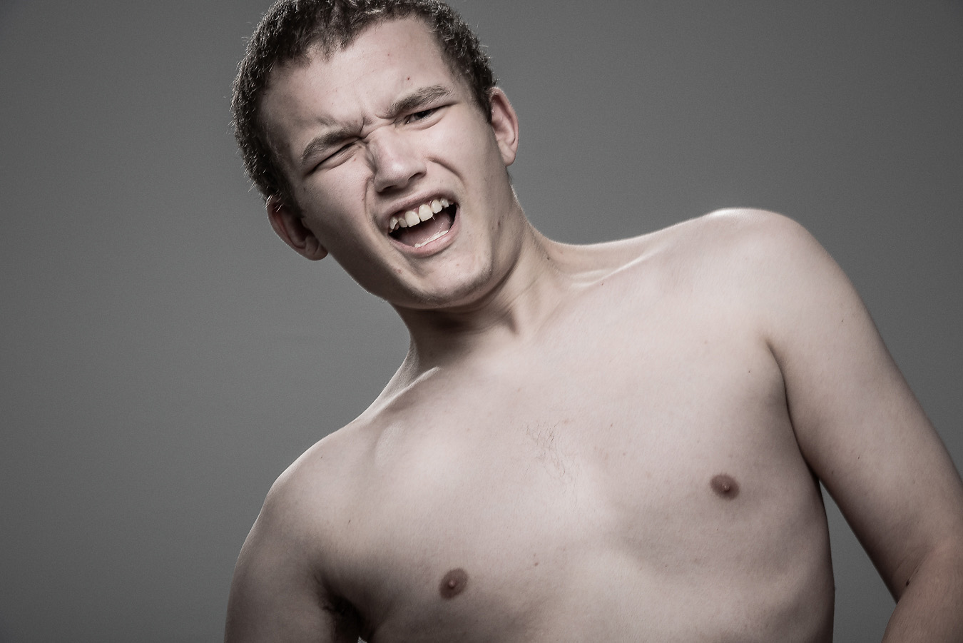 Studio headshot portrait 62 from the Stun Gun Photoshoot series, person gasping open-mouthed as they are hit with a stun gun